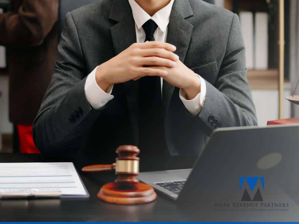 Business professional discussing legal strategies for Debt Recovery at office desk